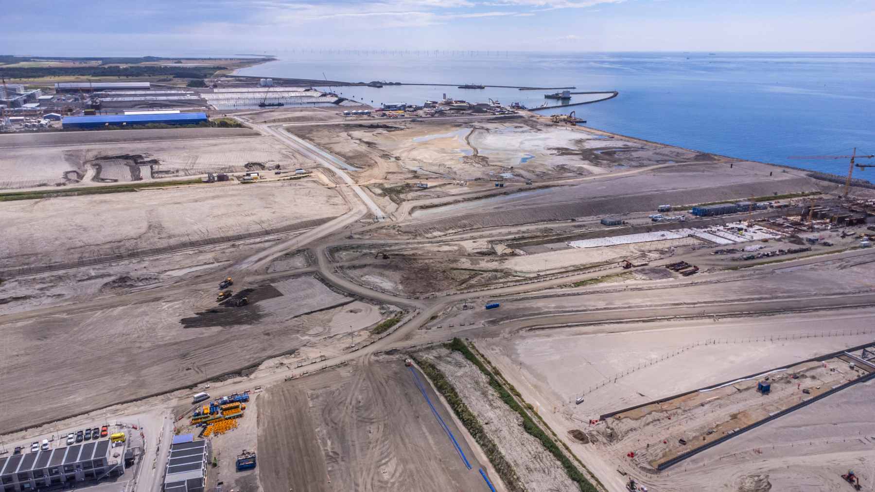 A massive 73,000-ton concrete tunnel block being maneuvered by a custom pontoon vessel into the Baltic Sea for the Fehmarnbelt link.