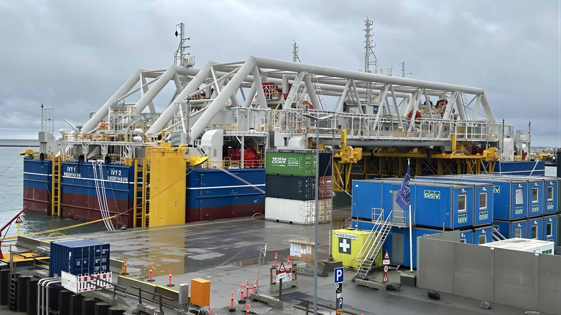 A massive 73,000-ton concrete tunnel block being maneuvered by a custom pontoon vessel into the Baltic Sea for the Fehmarnbelt link.