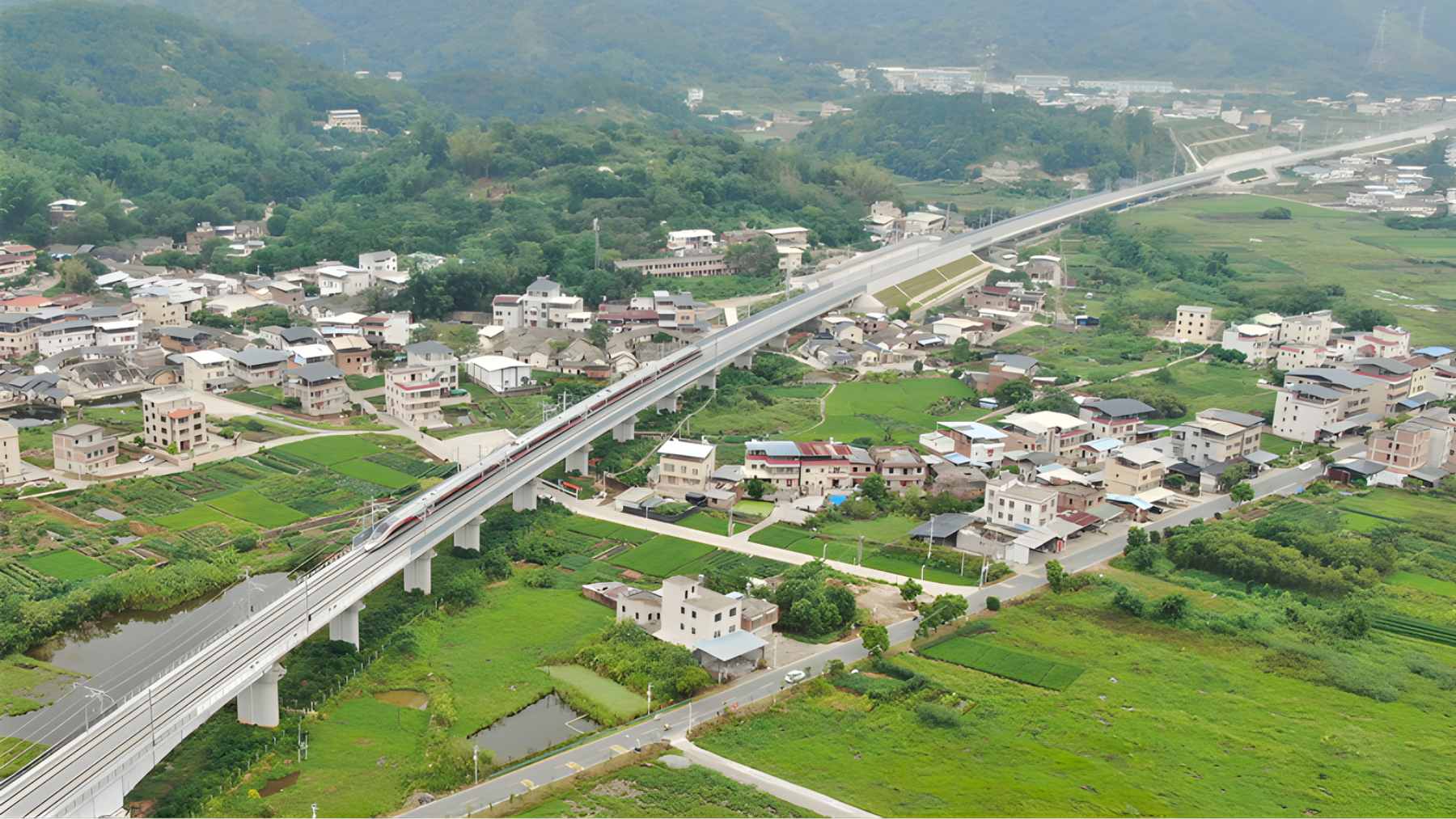 An aerial view of 1,500 workers and 23 excavators performing an overnight railway junction upgrade at Longyan Station.