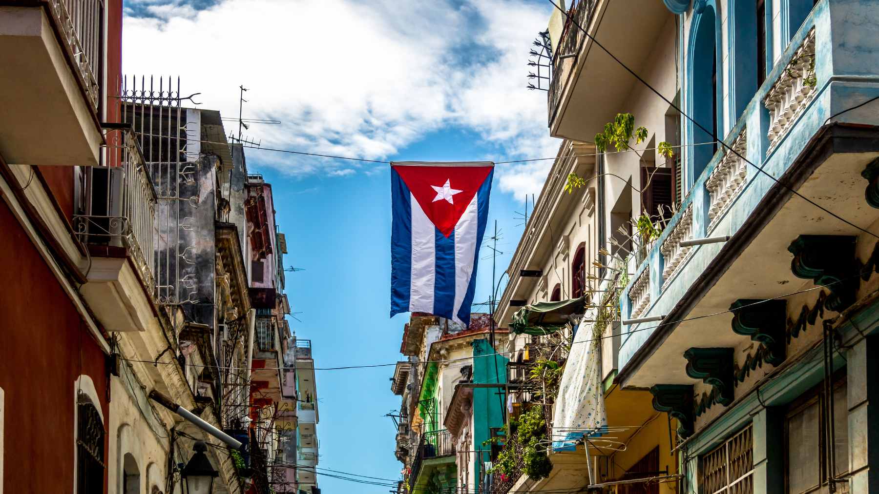 A newly installed solar photovoltaic park in Cuba, featuring rows of panels providing decentralized energy to local municipalities.