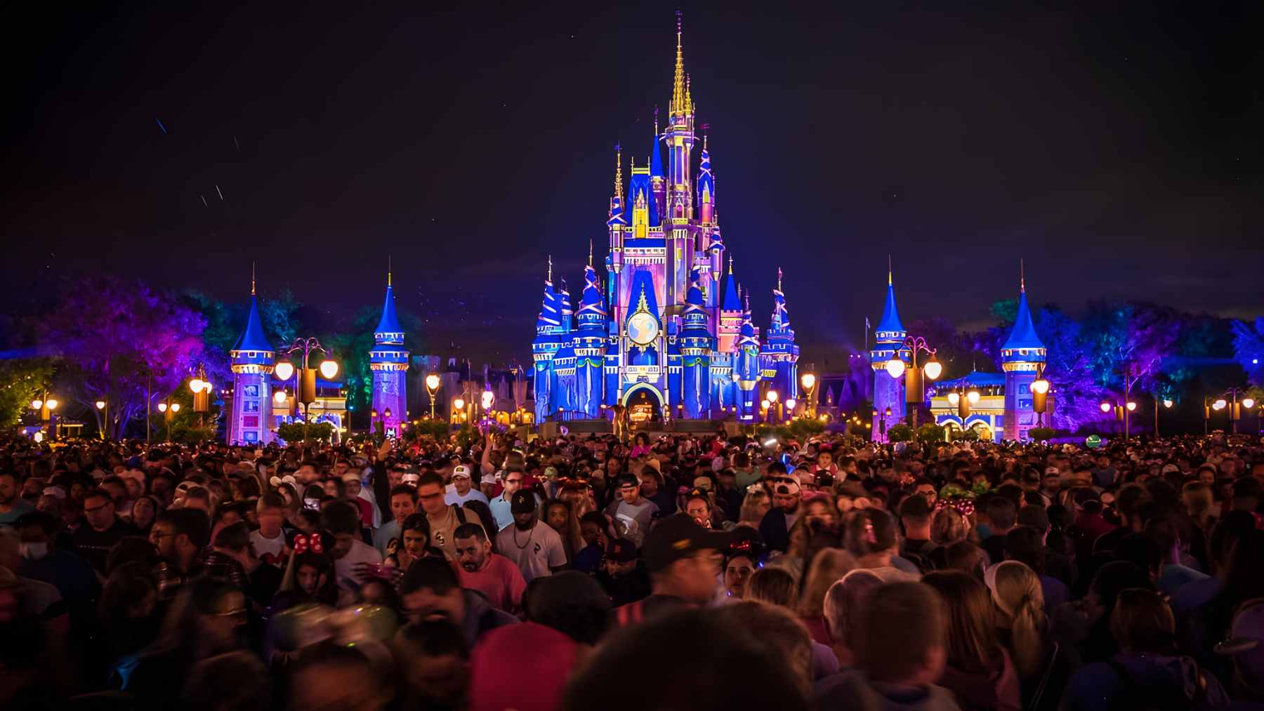 A digital display at the entrance of Disneyland Paris showing a notification that the parks have reached maximum capacity and are no longer admitting guests.