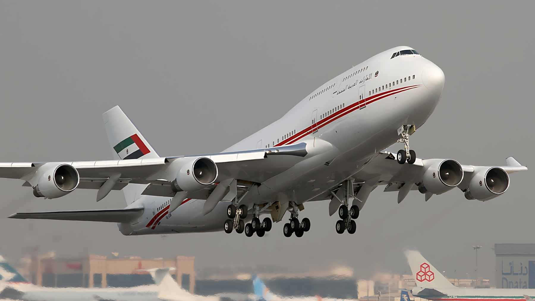 A Dubai Air Wing Boeing 747-400 freighter on a runway, used for the international transport of Godolphin racehorses.