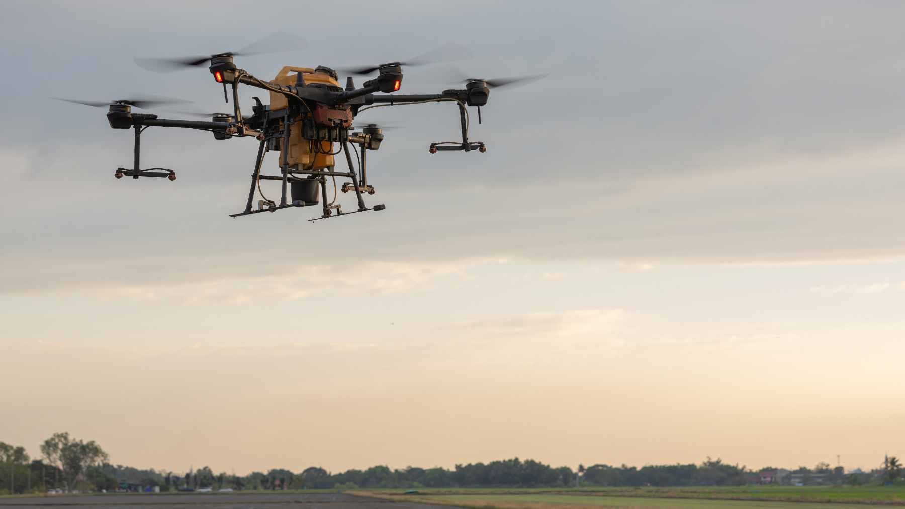 A high-tech defense manufacturing facility showing the assembly of modular drone components and solid rocket motor casings for Indo-Pacific security.