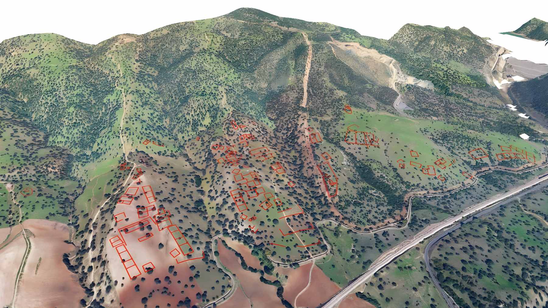 A digital elevation model generated by LiDAR showing the rectangular urban grid and terraces of a buried city in the hills of Córdoba.
