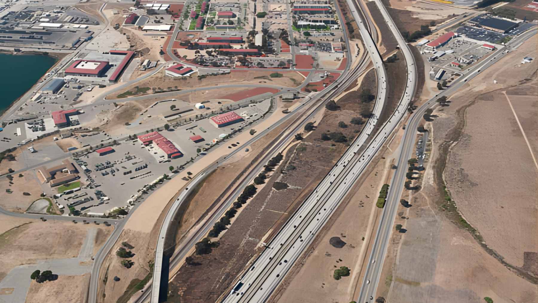 An aerial view of Interstate 5 running alongside the coastal training grounds of Marine Corps Base Camp Pendleton in California.