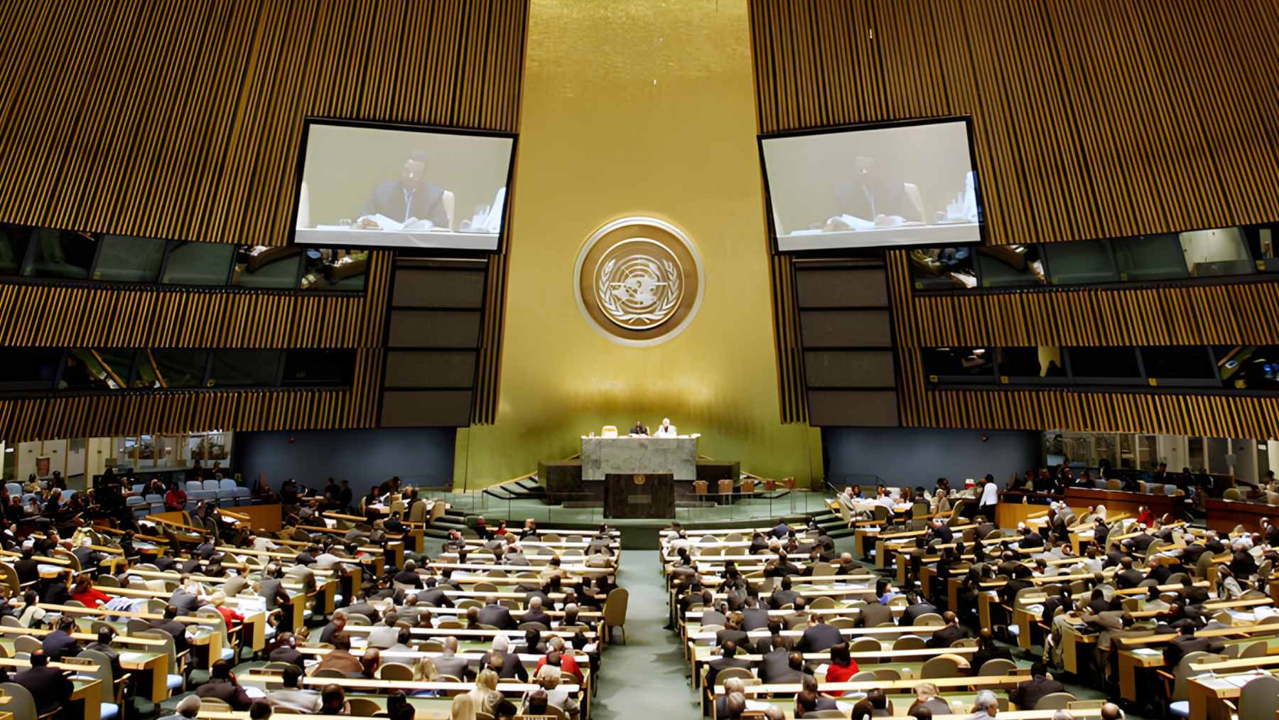 The United Nations General Assembly voting board displaying the passage of Mexico's resolution to limit artificial intelligence in nuclear command systems.