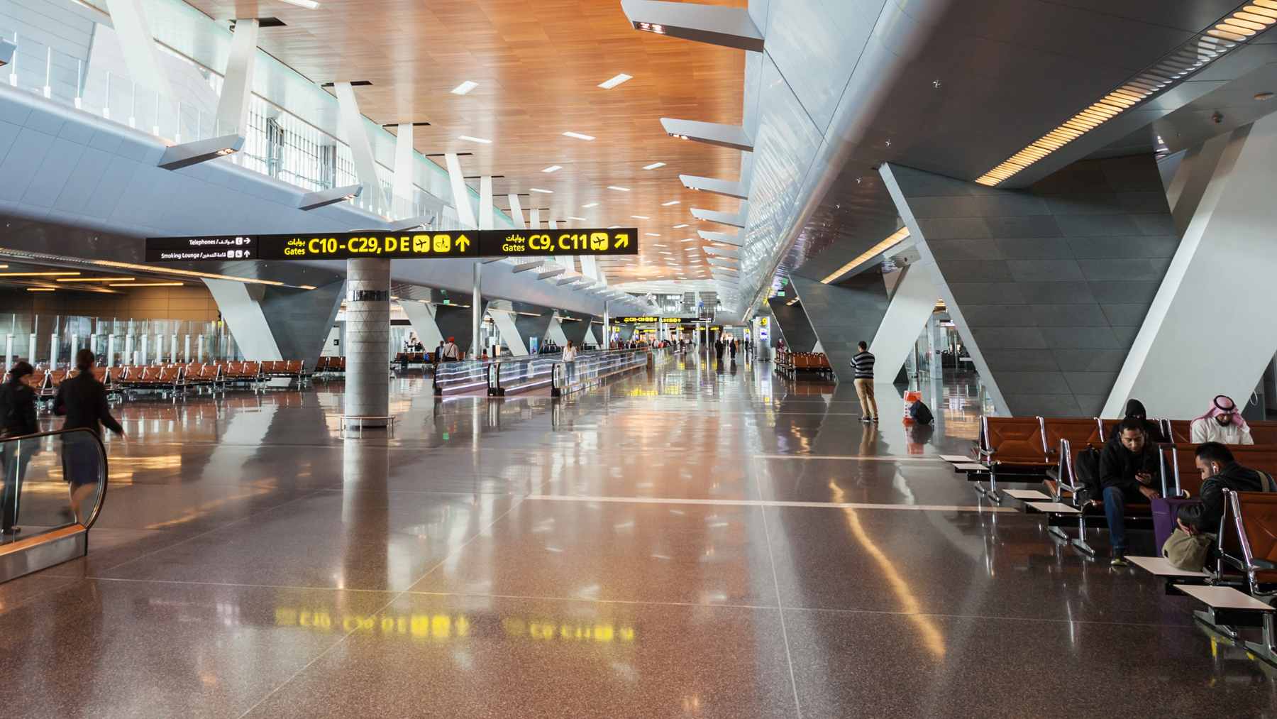 Stranded passengers wait with their luggage at a Middle Eastern airport terminal during the recent aviation crisis.
