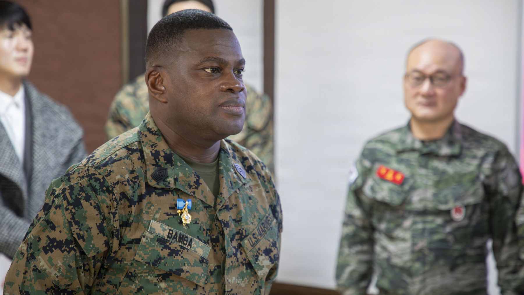 U.S. Marine Corps Sgt. Maj. Ismael G. Bamba standing at attention during the Prime Minister’s Commendation ceremony in South Korea.