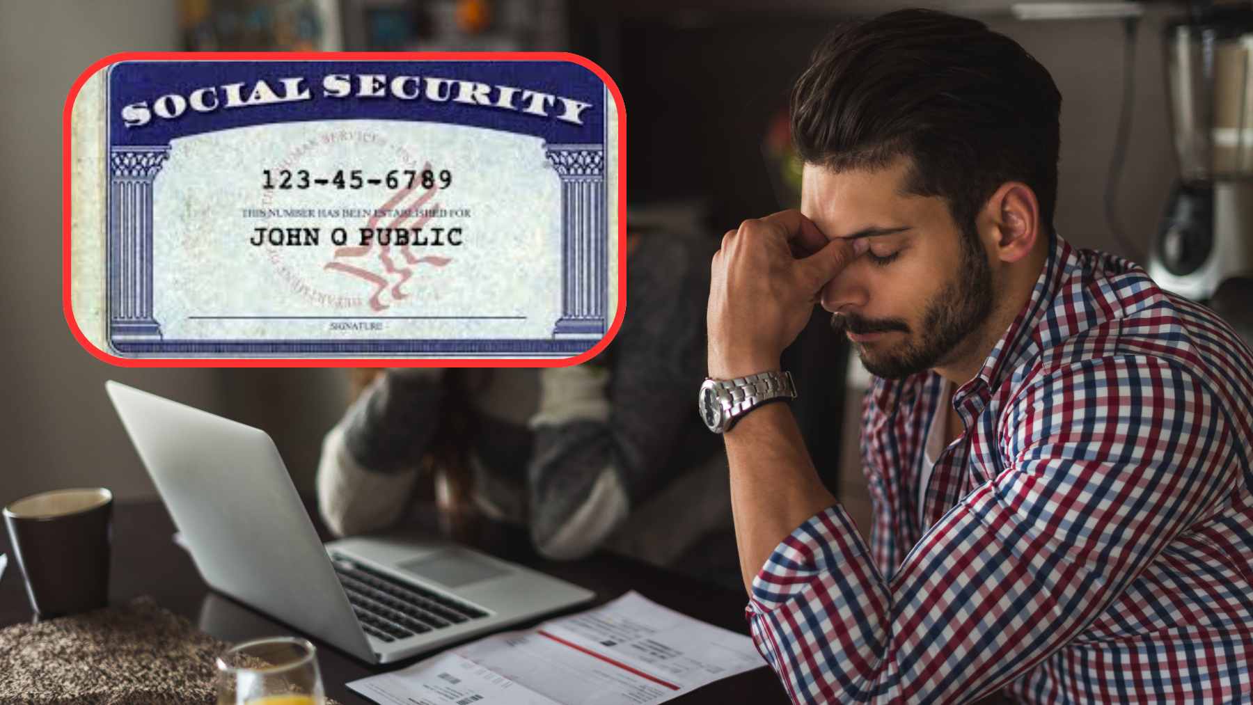 An official Social Security card resting on a keyboard, symbolizing the risk of digital identity exposure.