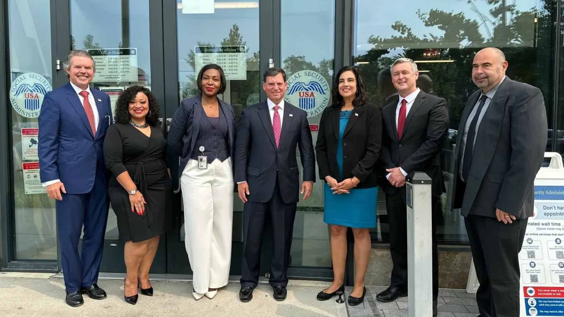 Social Security Administration office exterior with people entering, representing the shift to the new national service model.