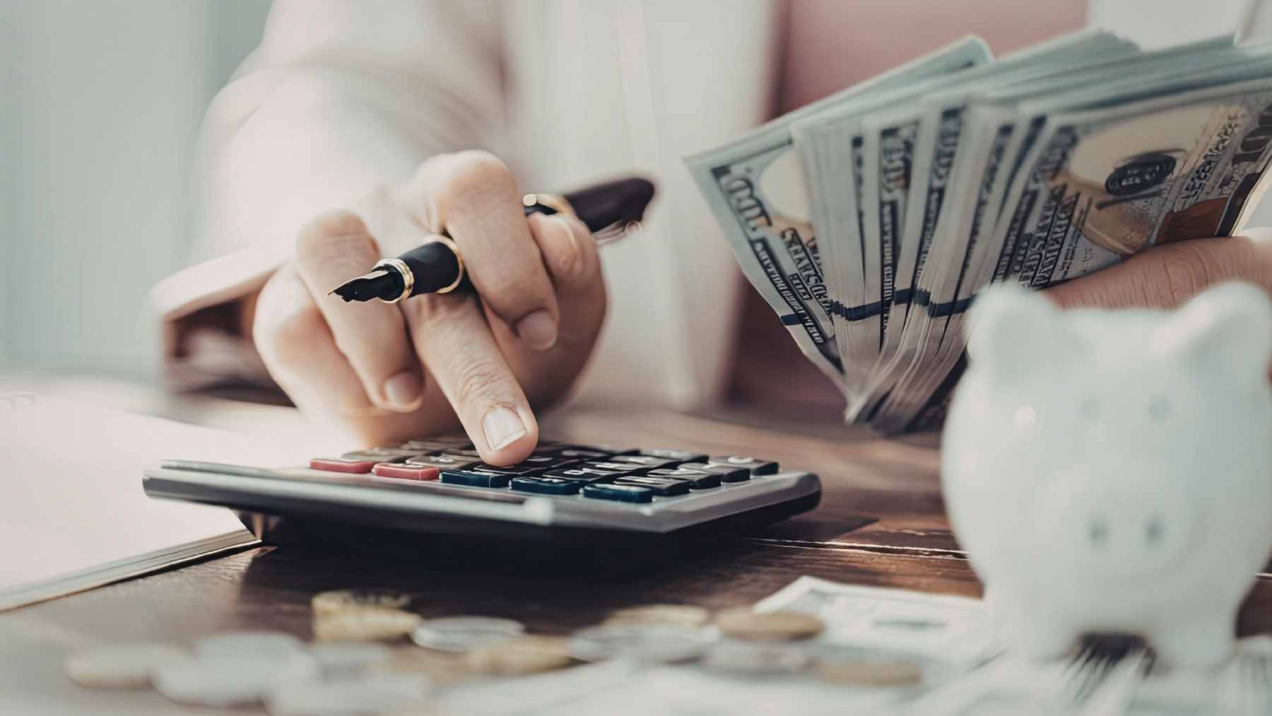 A close-up of a forged bank check sitting next to a monthly financial statement.