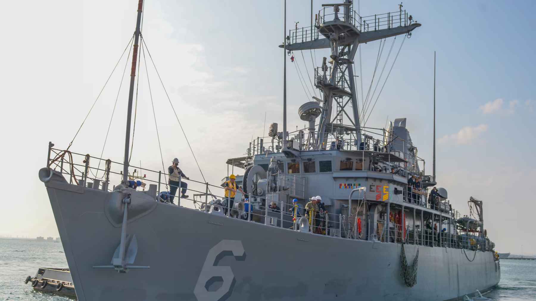U.S. Navy mine countermeasures ship operating at sea, illustrating the defensive naval capability at the center of new concerns in the Middle East