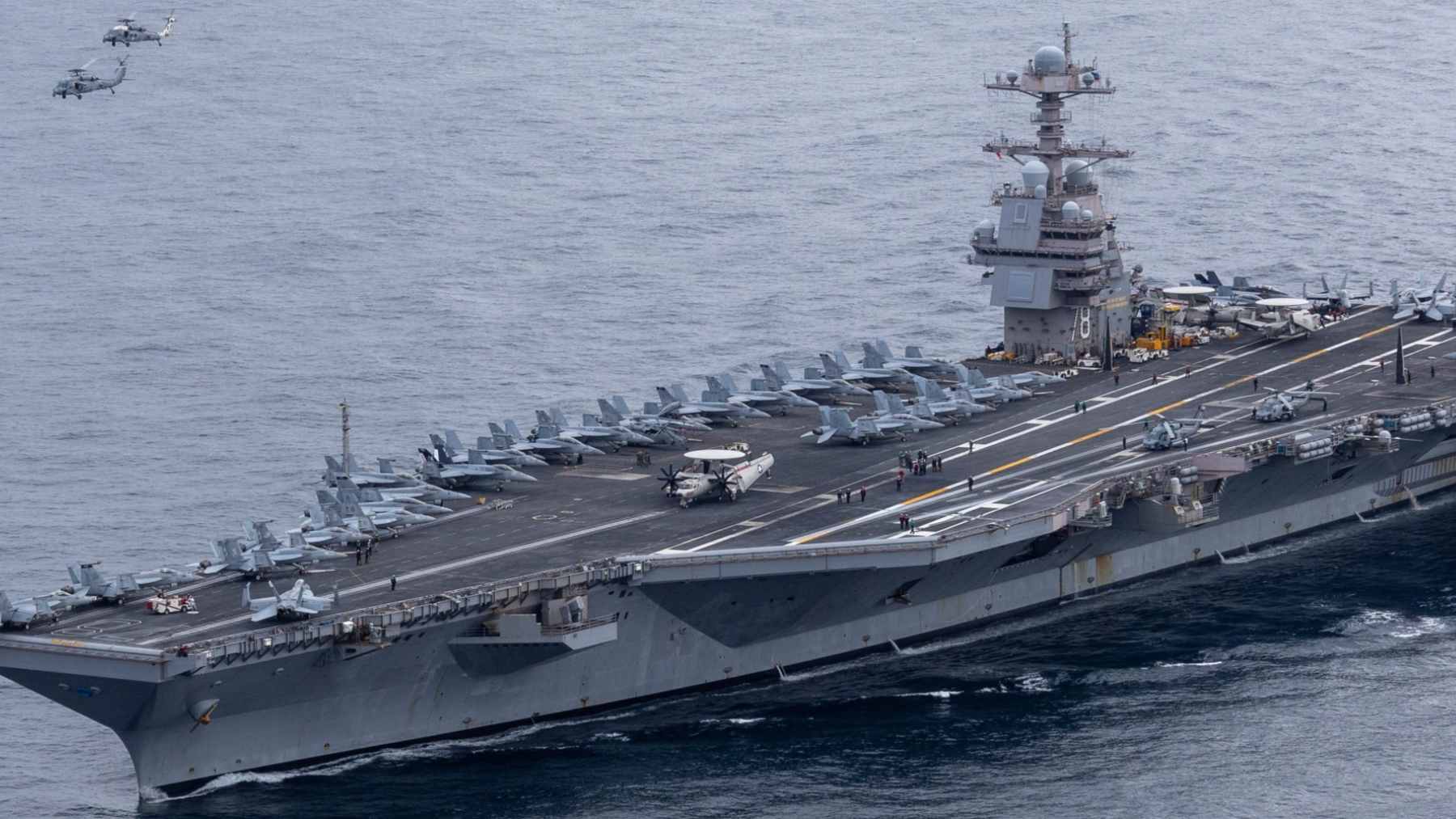 An aerial view of the USS Gerald R. Ford (CVN 78) aircraft carrier navigating the Red Sea during its 2026 deployment.