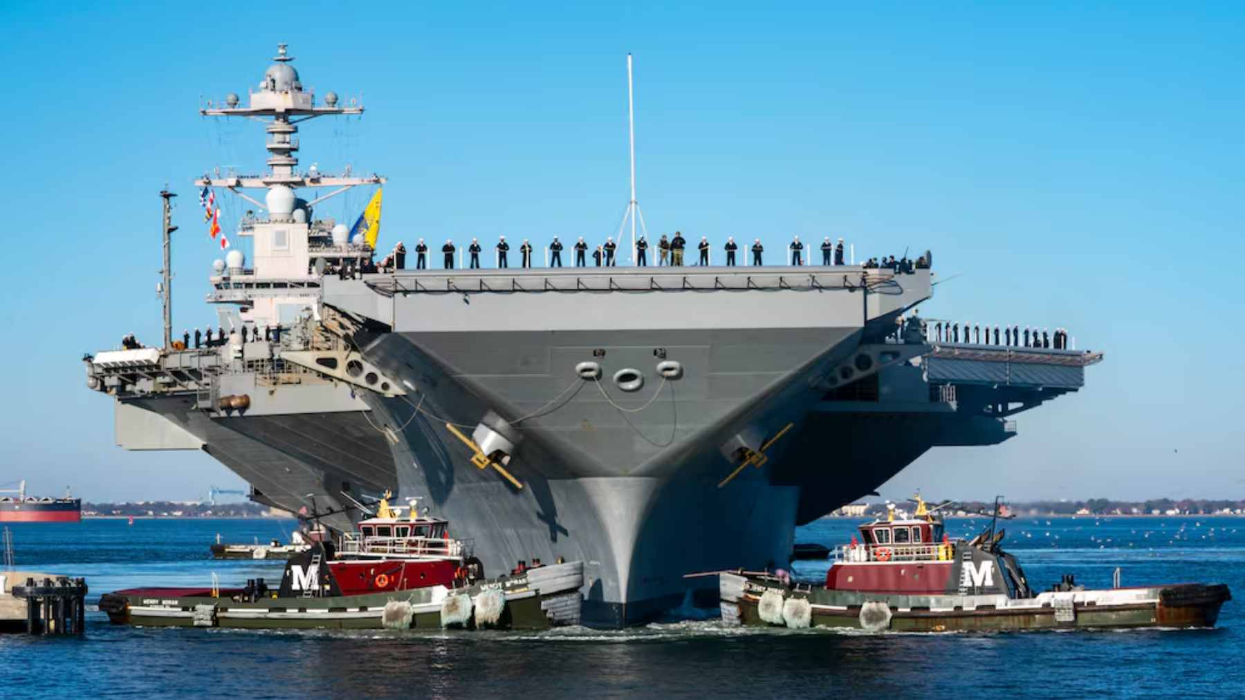 The USS Gerald R. Ford aircraft carrier navigating open waters during its historic 300-day global deployment.