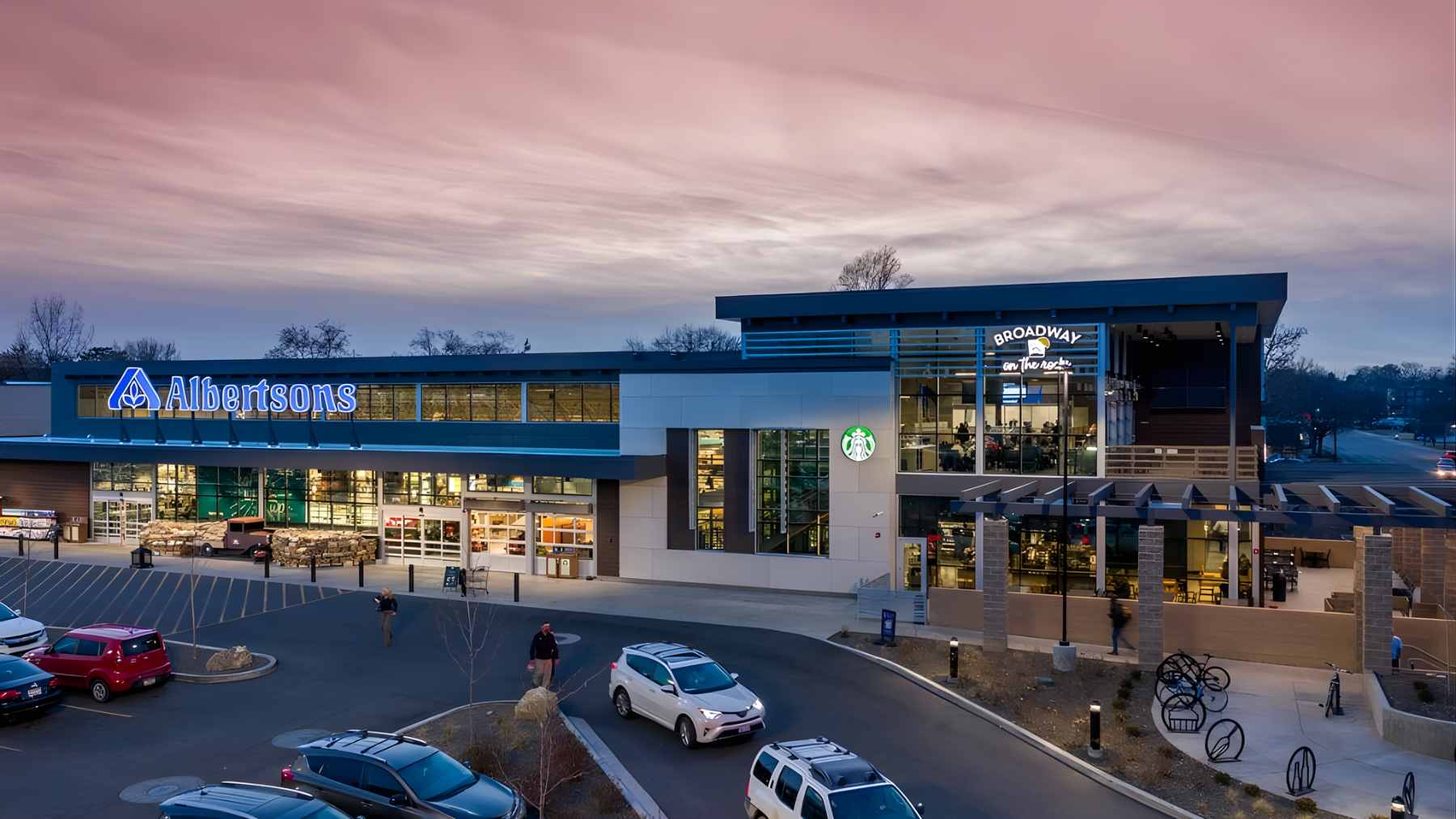 The exterior of a recently closed Albertsons grocery store with empty parking spaces.