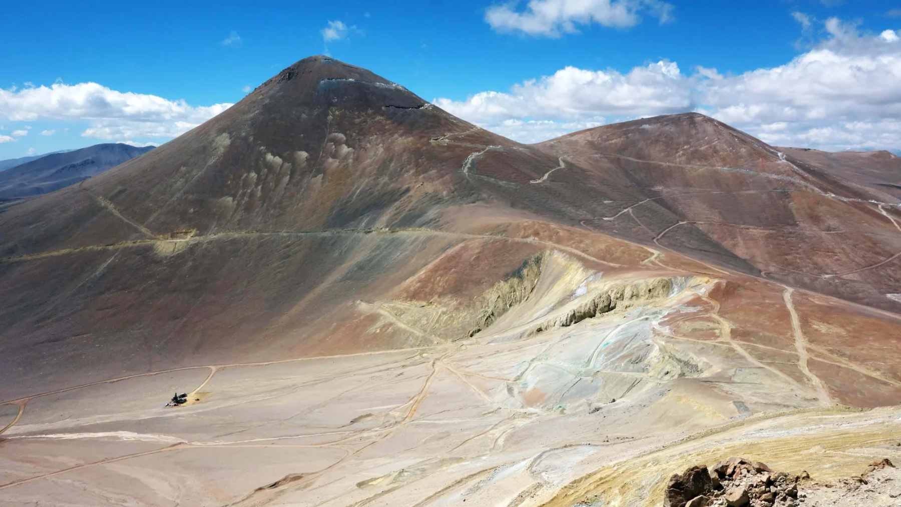 A rugged, snow-capped mountain peak in the high Andes where the Filo del Sol copper deposit is located.