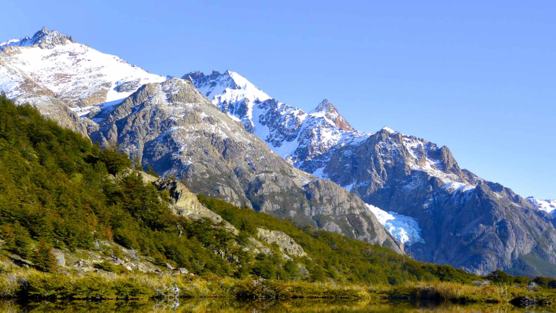 A rugged, snow-capped mountain peak in the high Andes where the Filo del Sol copper deposit is located.