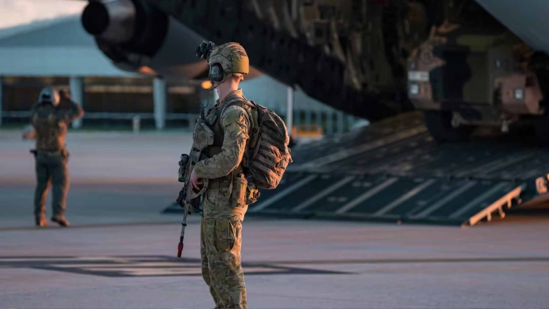 Australian defense forces operating autonomous drone technology in a remote field environment.