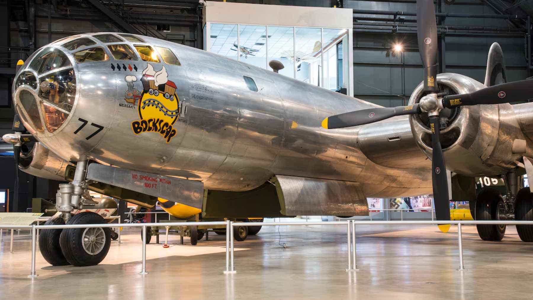 The restored Boeing B-29 Superfortress nicknamed "Doc" in flight, showing its polished aluminum exterior and four radial engines.