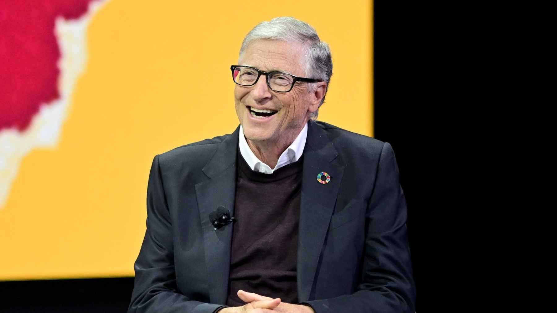 A massive server room in a high-tech data center illuminated by blue LED lights, with thick cooling pipes running along the ceiling.