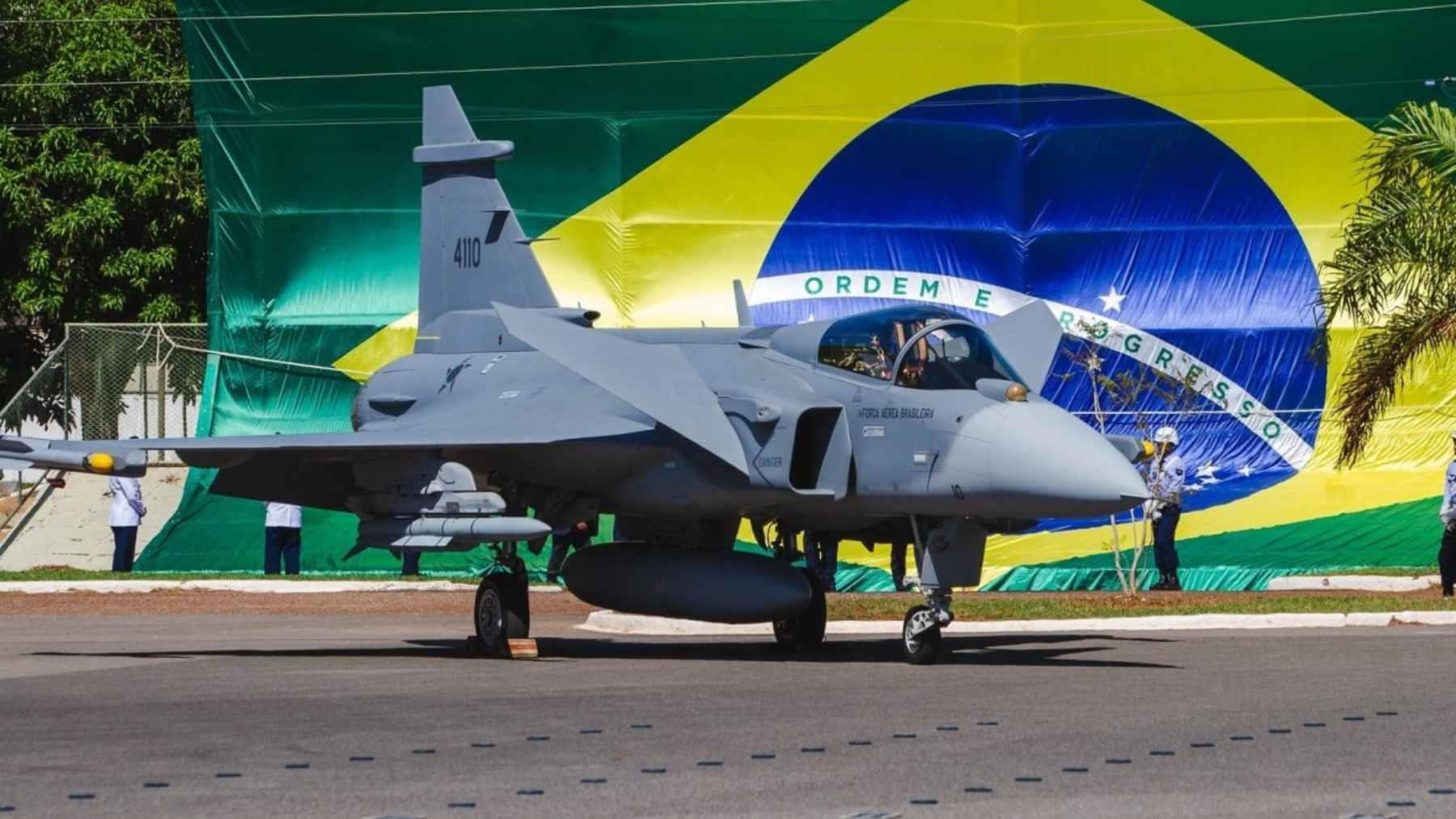The first Brazilian-assembled Saab Gripen E fighter jet displayed at Embraer's Gavião Peixoto facility during its official rollout ceremony.