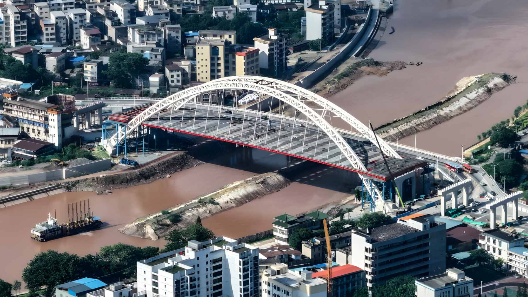 Aerial view of the Pinglu Canal construction in China, showing new commercial waterways alongside ecological green buffer zones.