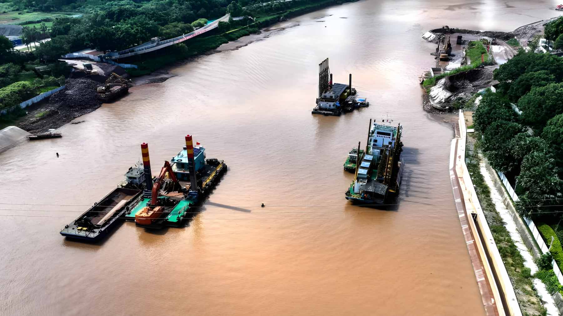 Aerial view of the Pinglu Canal construction in China, showing new commercial waterways alongside ecological green buffer zones.