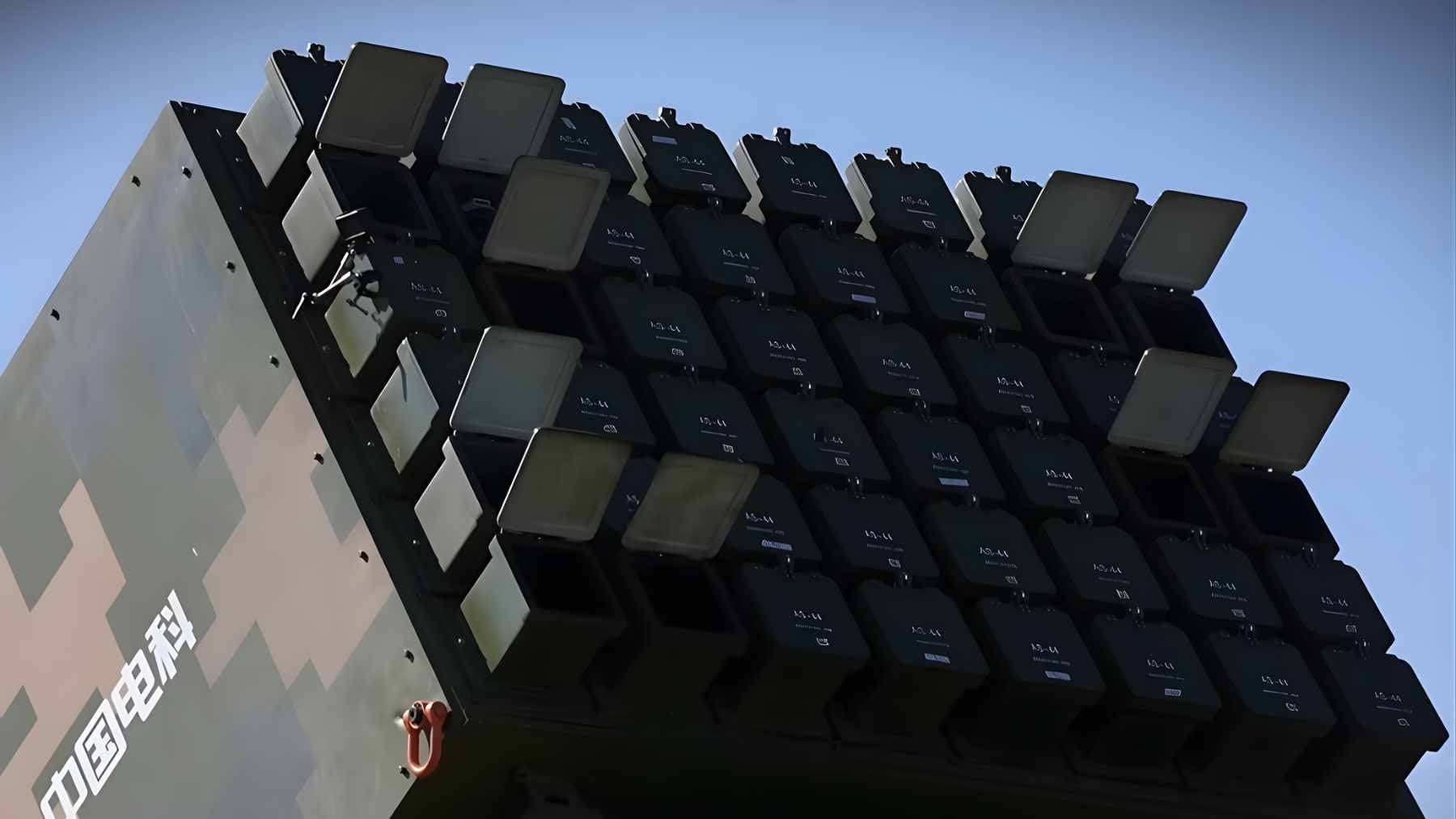 A Swarm-2 ground vehicle launching a fixed-wing drone into the sky during a military demonstration, part of China's Atlas swarm system.