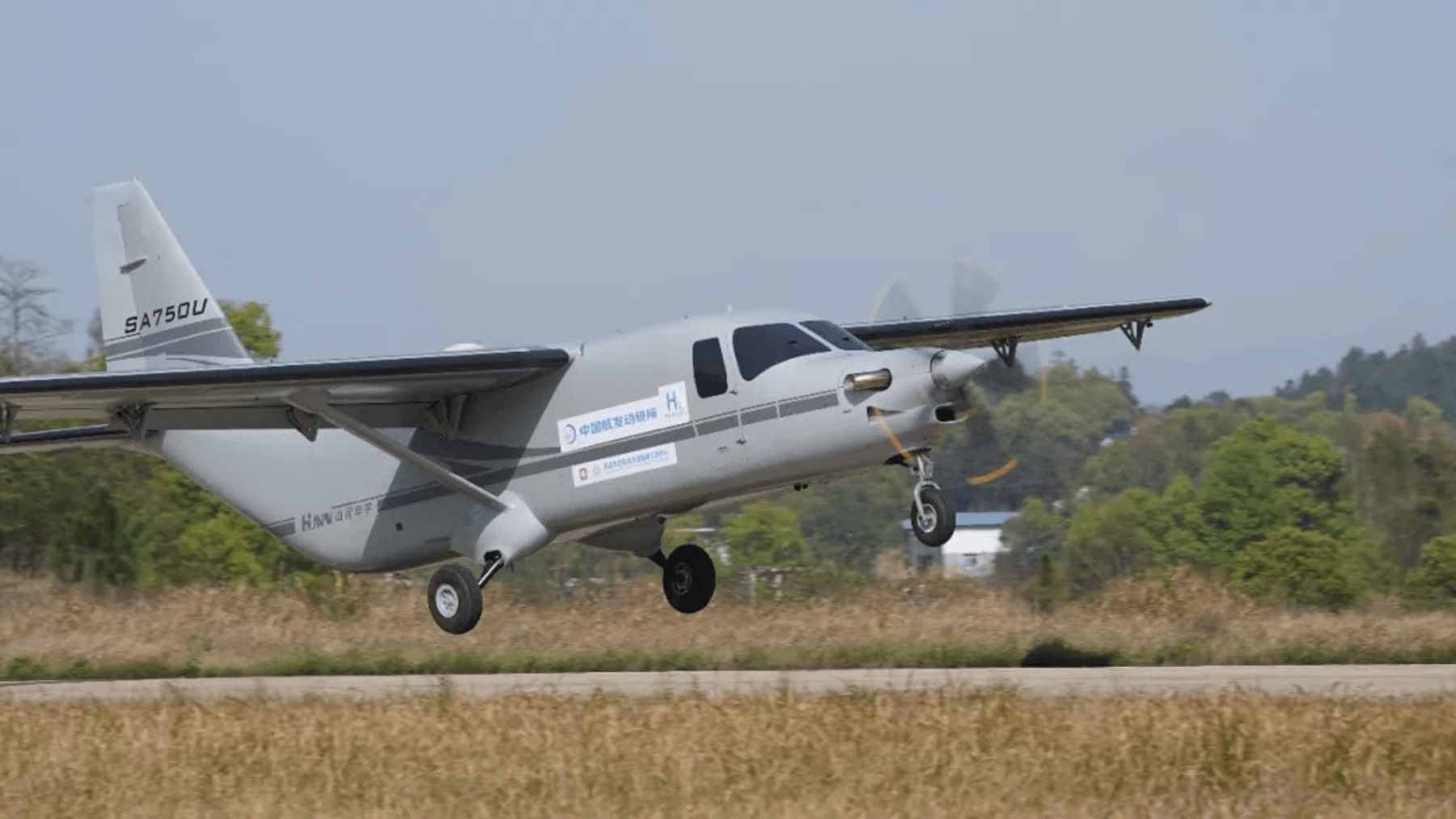 A large, unmanned cargo aircraft taking off from an airfield in China, powered by a hydrogen turboprop engine.