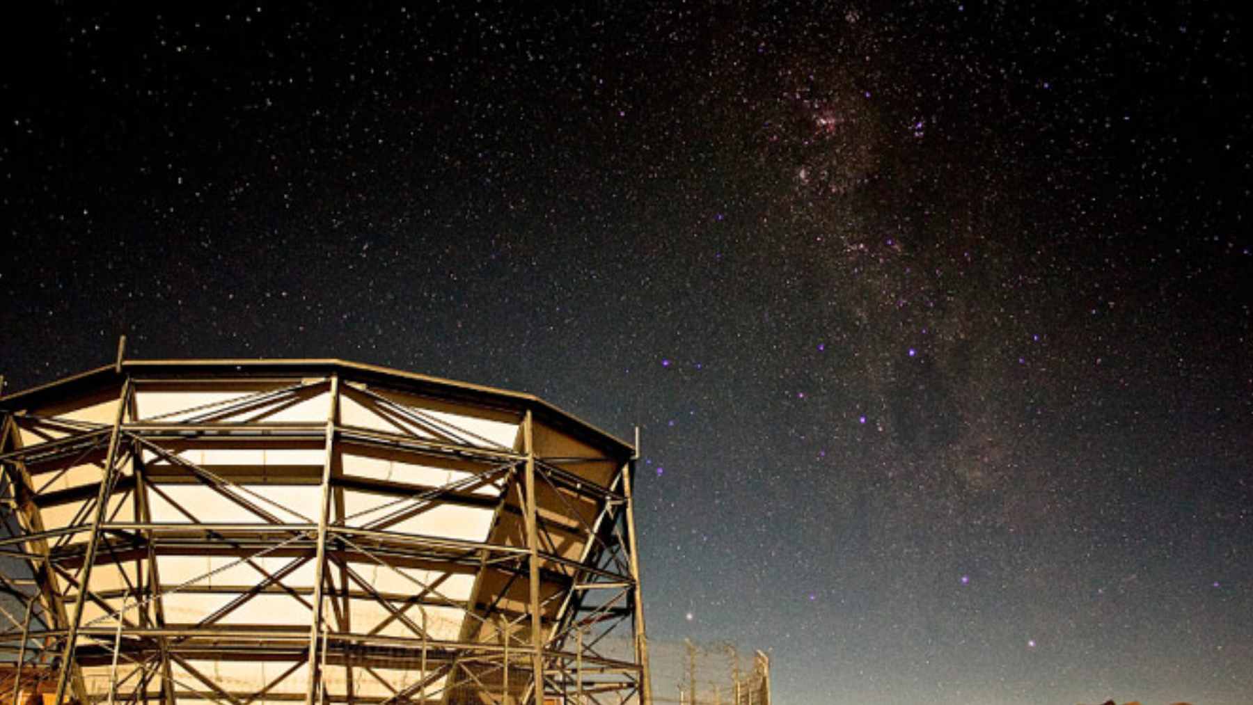 A colorful map of the cosmic microwave background showing the ancient light used to test gravitational forces across distant galaxy clusters.