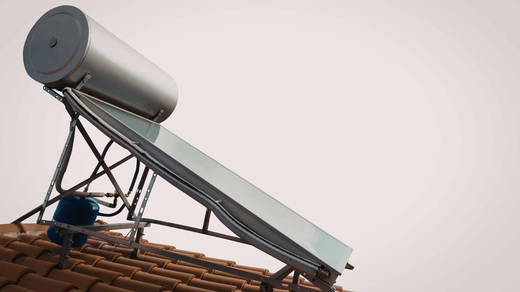 A DIY solar-powered cooling setup featuring copper coils and an insulated water tank functioning as an ice battery.
