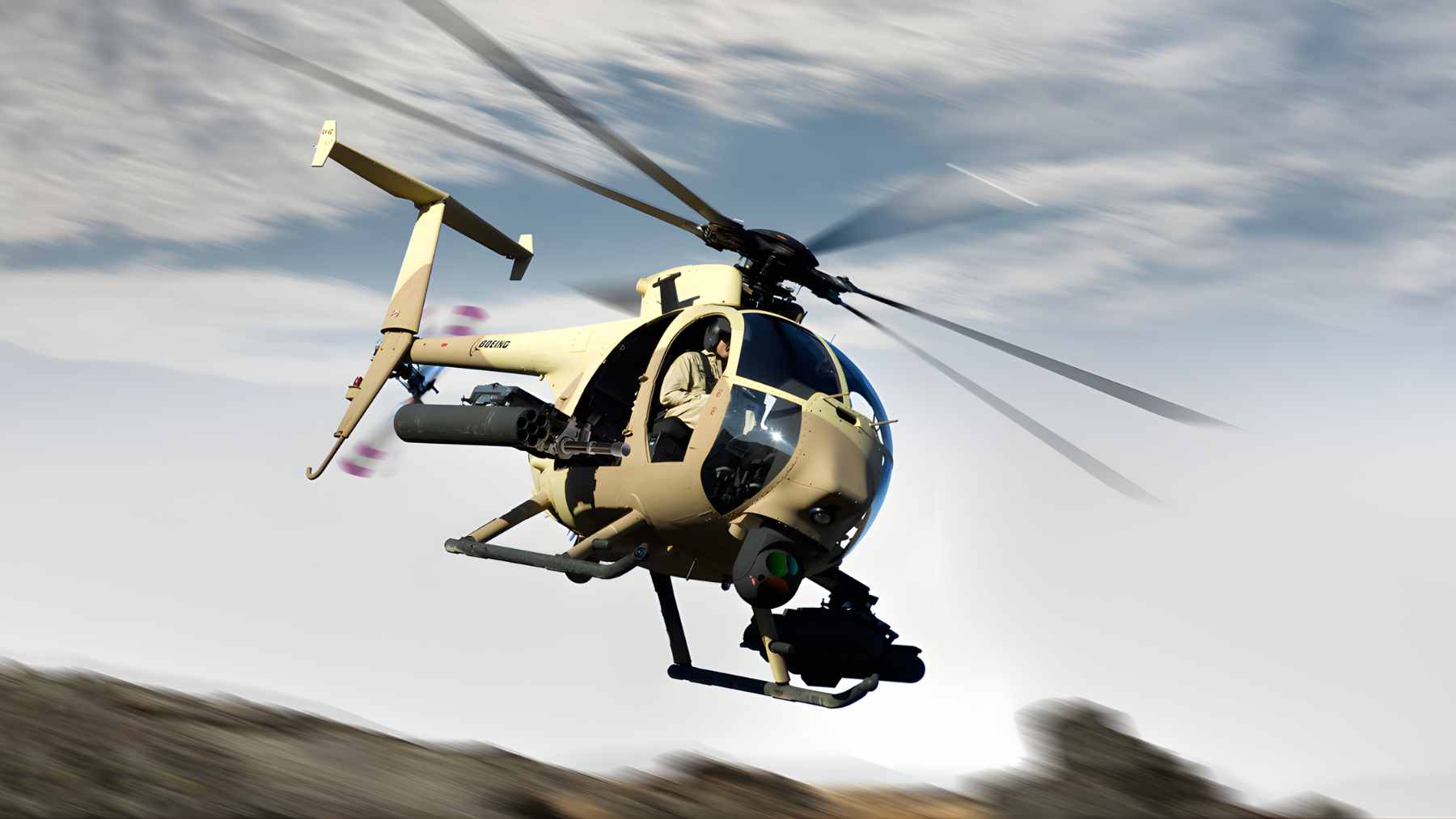 A small, dark MH-6 Little Bird helicopter flying low over rugged, mountainous terrain.