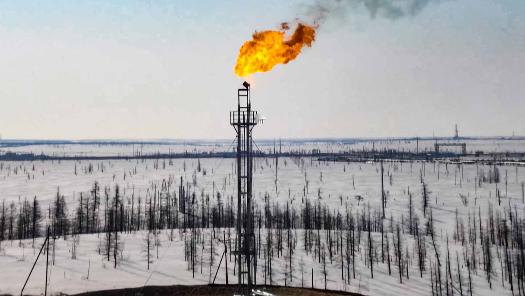 A large-scale natural gas compressor station with complex piping, representing the trans-border energy infrastructure between Hungary and Ukraine.