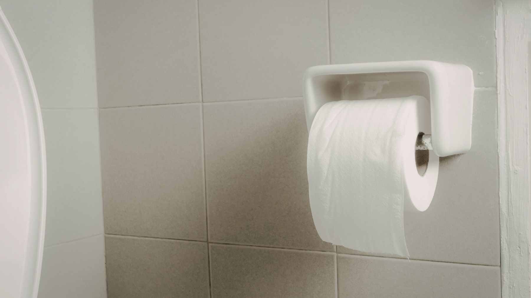 A large two-story house sitting on a very small plot of land, illustrating the limited space available for a septic system.