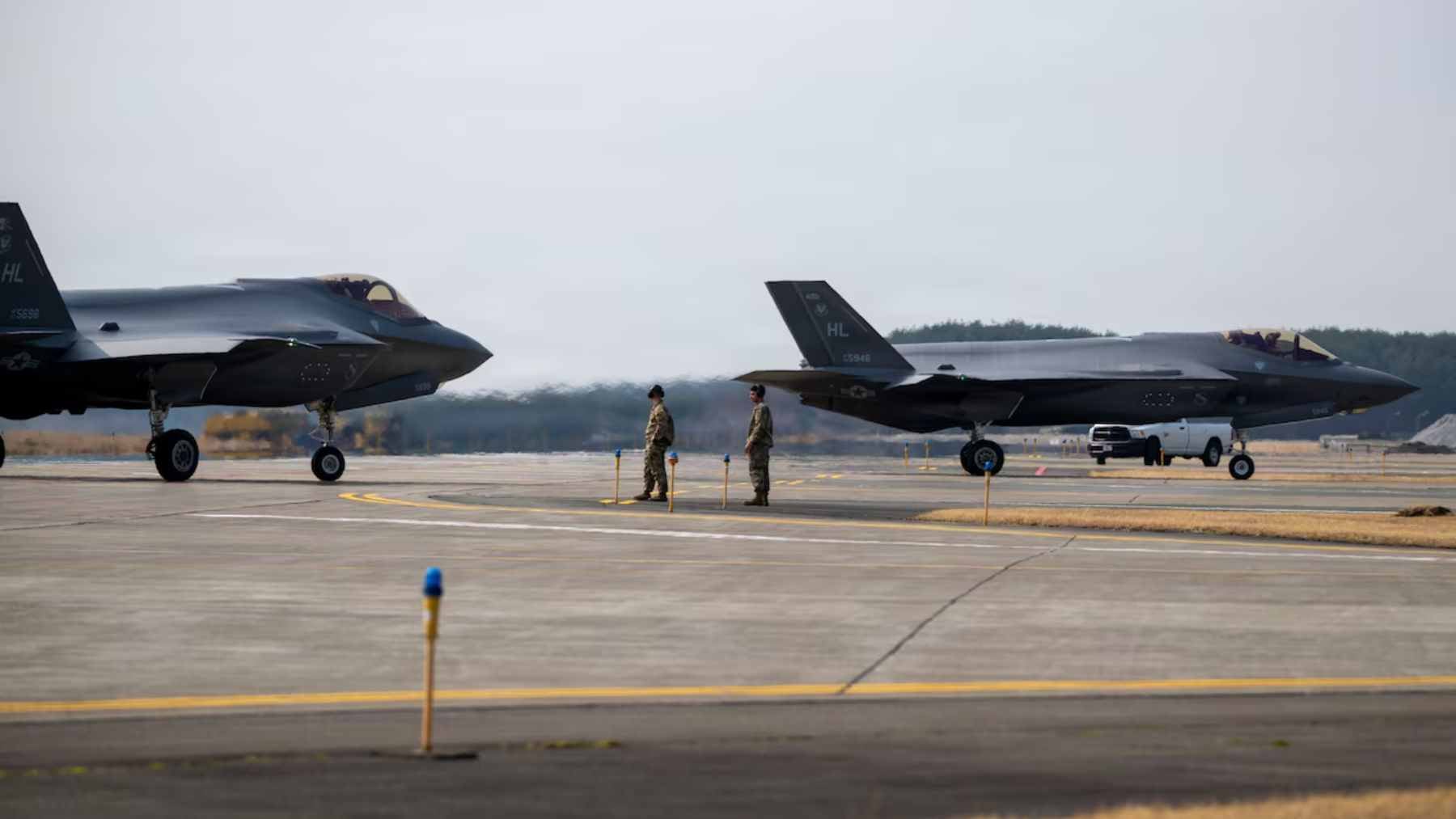 A U.S. Air Force F-35A Lightning II stealth fighter jet taxiing on the runway at Misawa Air Base in Japan.