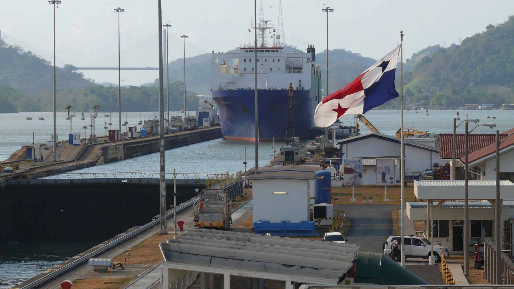 A conceptual digital rendering showing pedestrians and cyclists traveling through a brightly lit, modern tunnel beneath the Panama Canal.