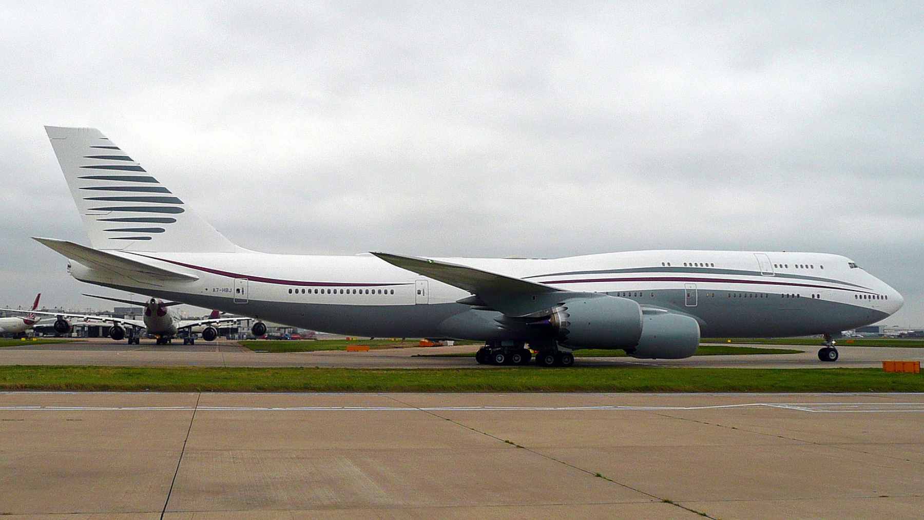 A Boeing 747-8i aircraft undergoing modifications on the tarmac to become the temporary VC-25B Bridge Aircraft.