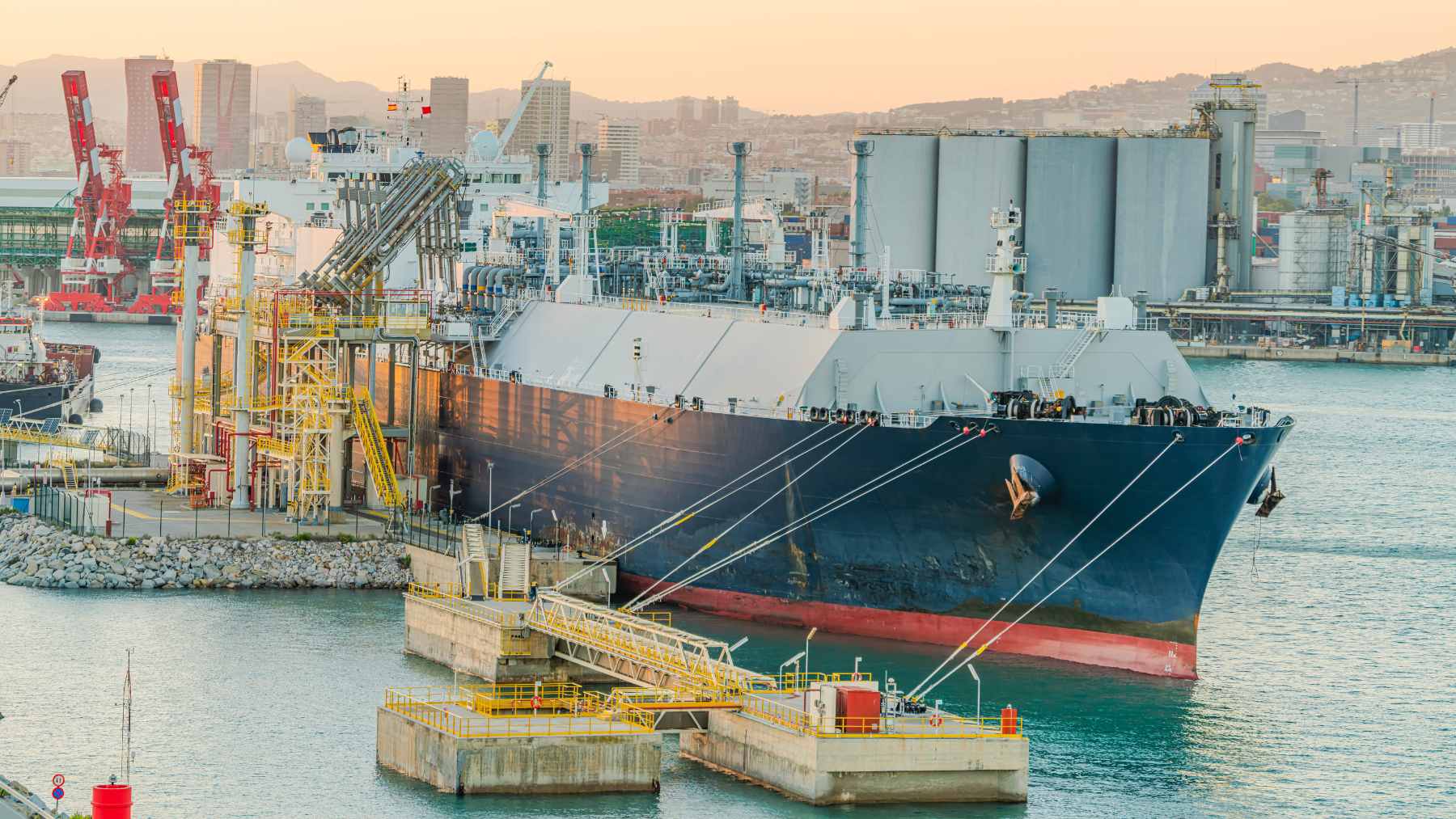 A massive ice-breaking LNG carrier ship transporting Russian natural gas through frozen Arctic waters.