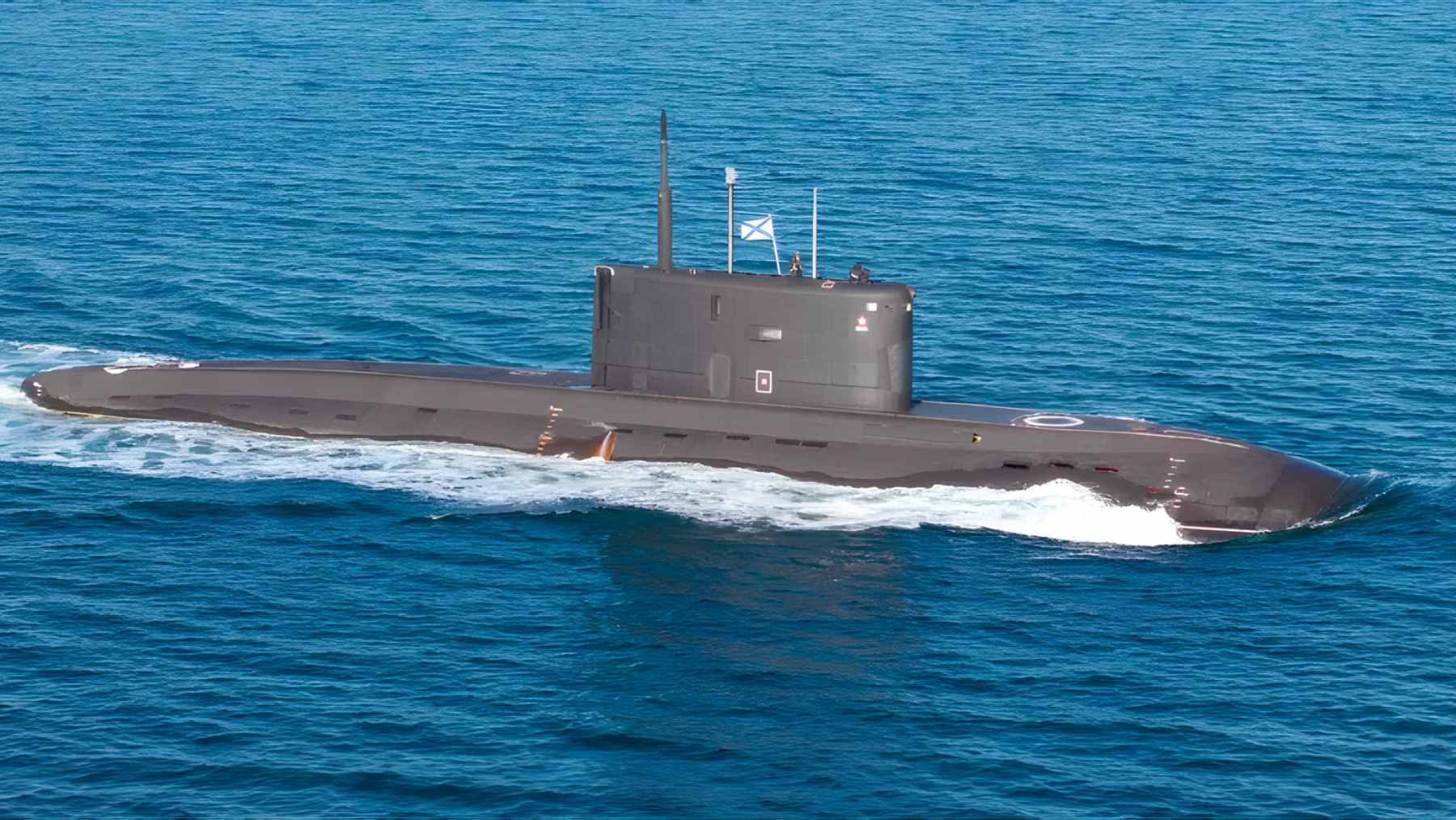 A Royal Navy warship navigating choppy waters while closely shadowing a surfaced Russian submarine in the English Channel.