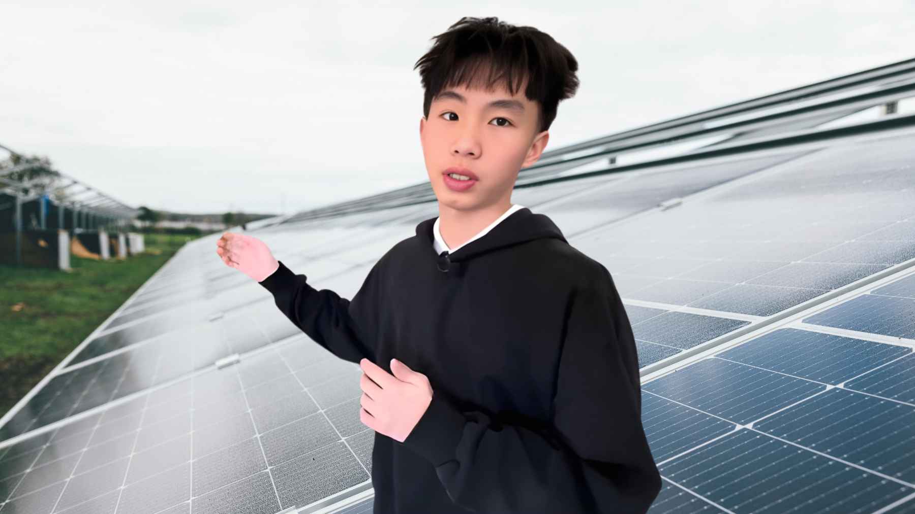 Young student standing beside solar panels, illustrating a seventh grader’s low-cost invention to boost solar power output