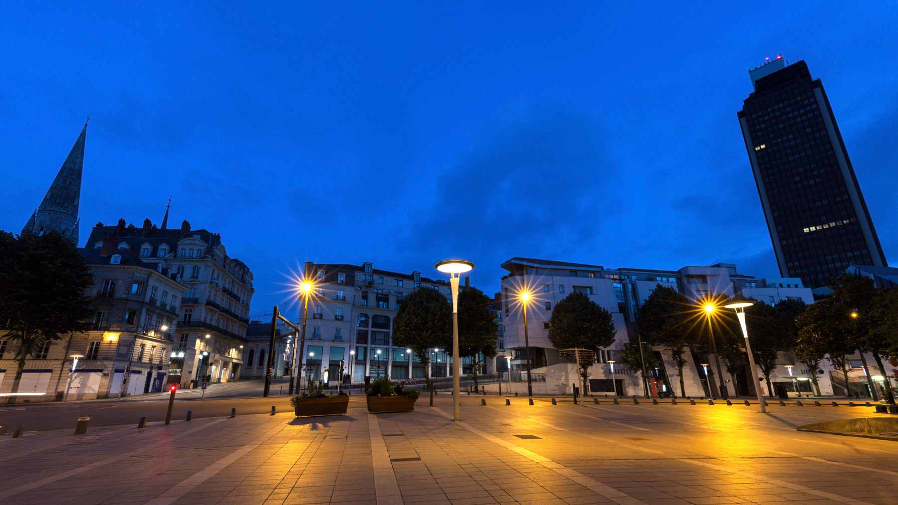 A conceptual view of massive, glowing orbital data centers and reflective space mirrors illuminating the night sky above Earth.