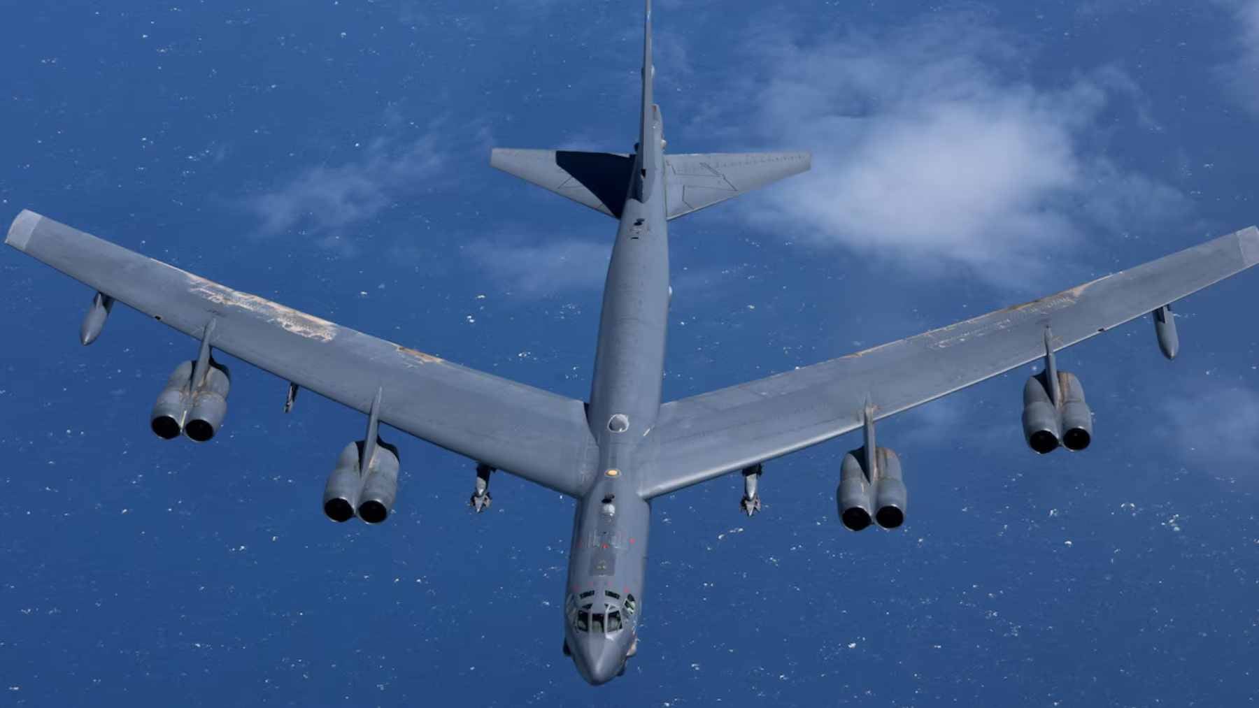 A U.S. Air Force B-52 bomber soaring through the sky on a long-range overland mission.