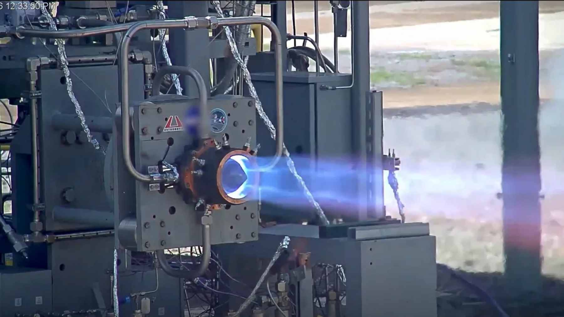 A hot-fire test of Astrobotic's Chakram rotating detonation rocket engine at NASA Marshall Space Flight Center, showing a bright, stable exhaust plume.