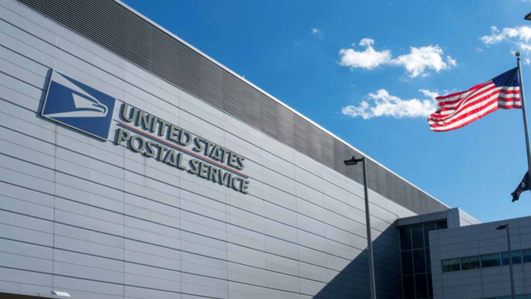 Temporary storage containers serving as a makeshift post office for residents in Baker, Montana, following the closure of the main facility.