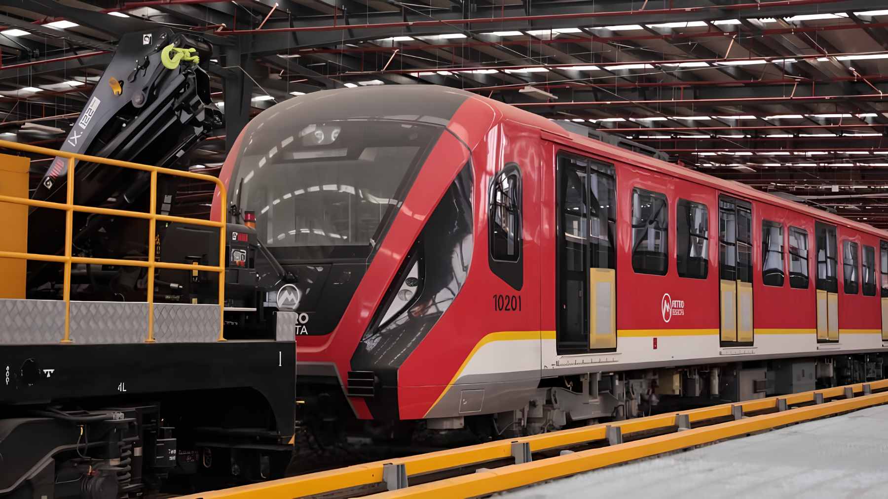 A new Chinese-manufactured automatic train car for the Bogotá Metro Line 1 being unloaded at a terminal in Colombia.