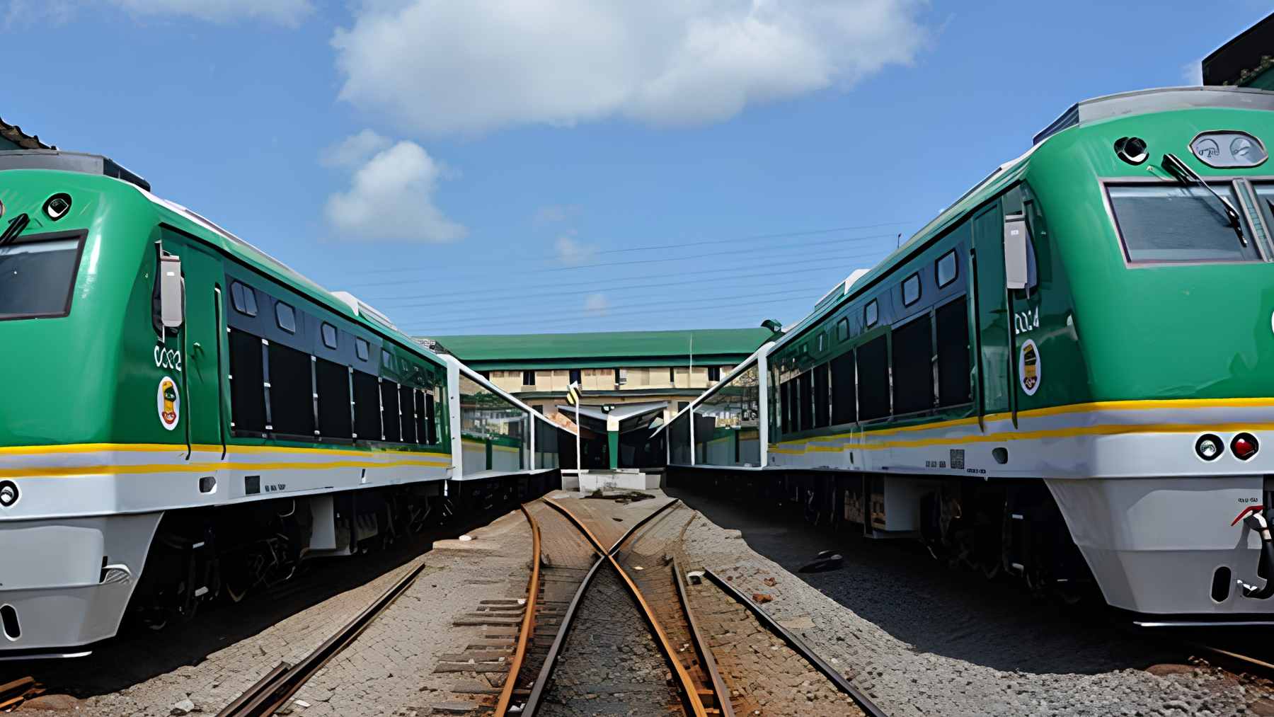 A modern passenger train arriving at a newly constructed standard-gauge railway station in Nigeria.