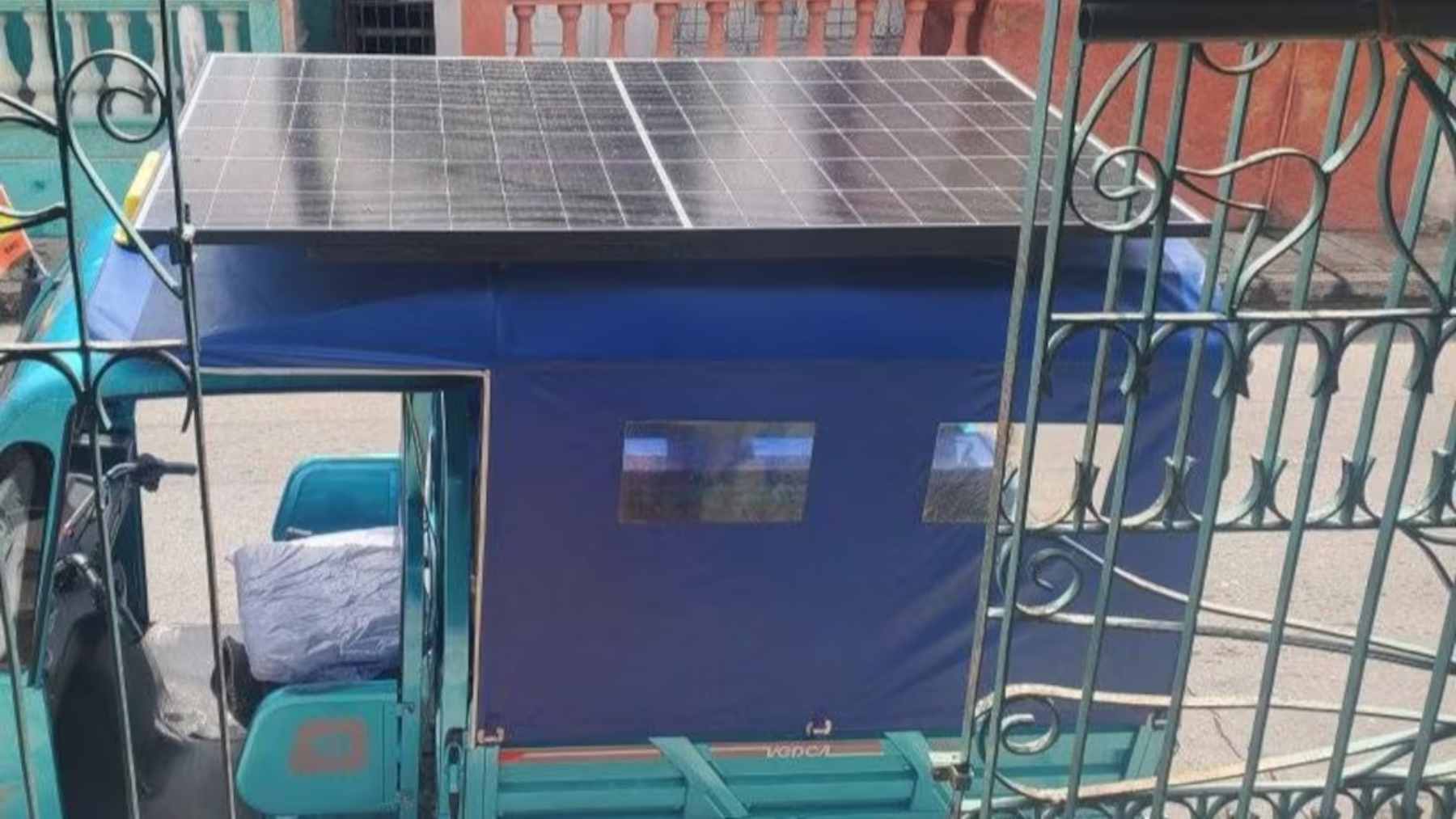 Cuba has no fuel and barely any electricity, but a 21-year-old built a homemade solar factory and turned 15 tricycles into lifelines 1 An electric cargo tricycle driving through Havana with a large solar panel mounted as its roof on a custom metal frame.