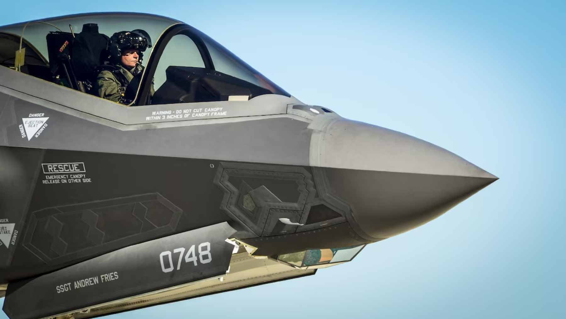 An F-35 fighter pilot wearing the advanced $400,000 Gen III Helmet Mounted Display System inside the cockpit.