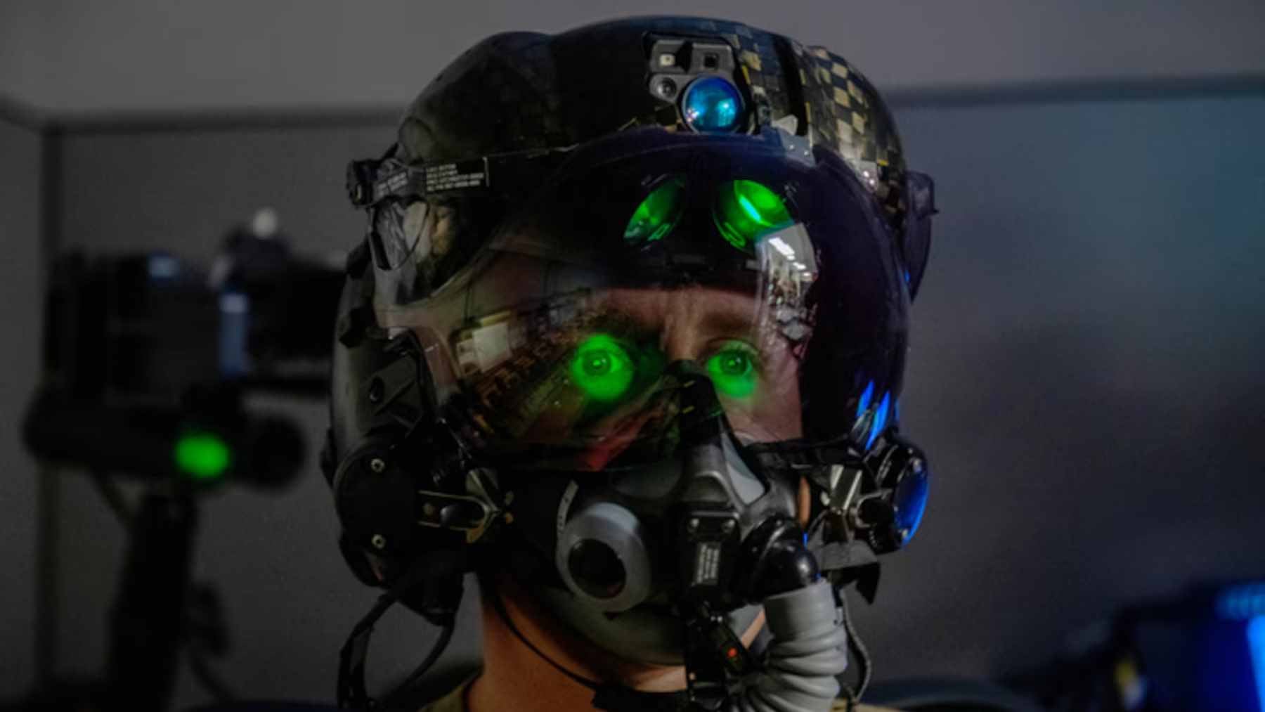 An F-35 fighter pilot wearing the advanced $400,000 Gen III Helmet Mounted Display System inside the cockpit.