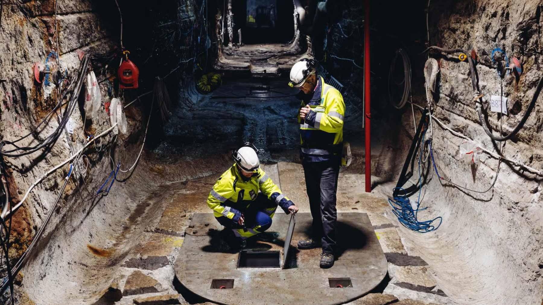 The main tunnel entrance and automated transport machinery at the Onkalo deep geological repository on Olkiluoto Island, Finland.